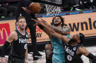 Brooklyn Nets forward Bruce Brown (1) stops Charlotte Hornets forward Miles Bridges from scoring during the second half of an NBA basketball game Friday, April 16, 2021, in New York. (AP Photo/Mary Altaffer)