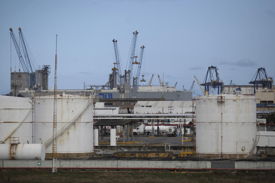 Fuel storage tanks sit at a dispatch terminal of Petroleos Mexicanos (Pemex), Mexico's state-owned oil company, in the port of Veracruz, Mexico, Dec. 30, 2016, days before the 2017 price deregulation goes into effect. Pemex executive Carlos Murriet said in recent days that the country currently has six days' worth in storage. (AP Photo/Felix Marquez)