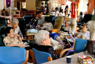 <p>Elderly people unable to return their houses after using a nursing home spend time in Toho, Fukuoka, Japan on July 6, 2017. (Photo: The Asahi Shimbun via Getty Images) </p>