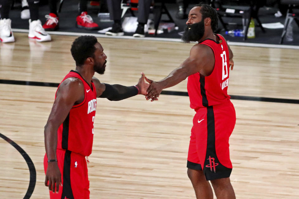 Houston Rockets guard James Harden (13) celebrates with forward Jeff Green, left, after a play against the Oklahoma City Thunder during the fourth quarter of Game 2 of an NBA basketball first-round playoff series, Thursday, Aug. 20, 2020, in Lake Buena Vista, Fla. (Kim Klement/Pool Photo via AP)