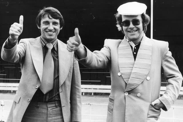 <p>Evening Standard/Getty</p> Graham Taylor and Elton John