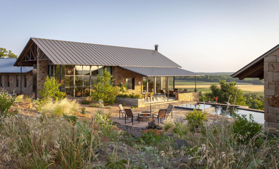 A natural swimming pool looking out over a view