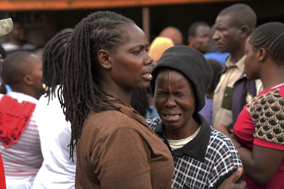 Relative wails near the bodies of women that were retrieved from a house, after heavy rain in the Mathare slum of Nairobi, Kenya, Wednesday, April 24, 2024. Heavy rains pounding different parts of Kenya have led to dozens of deaths and the displacement of tens of thousands of people, according to the U.N., citing the Red Cross. (AP Photo/Brian Inganga)