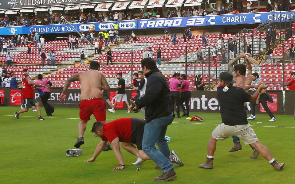 Pictured: Fan violence during top-flight Mexico football match leaves 22 people injured - Shutterstock