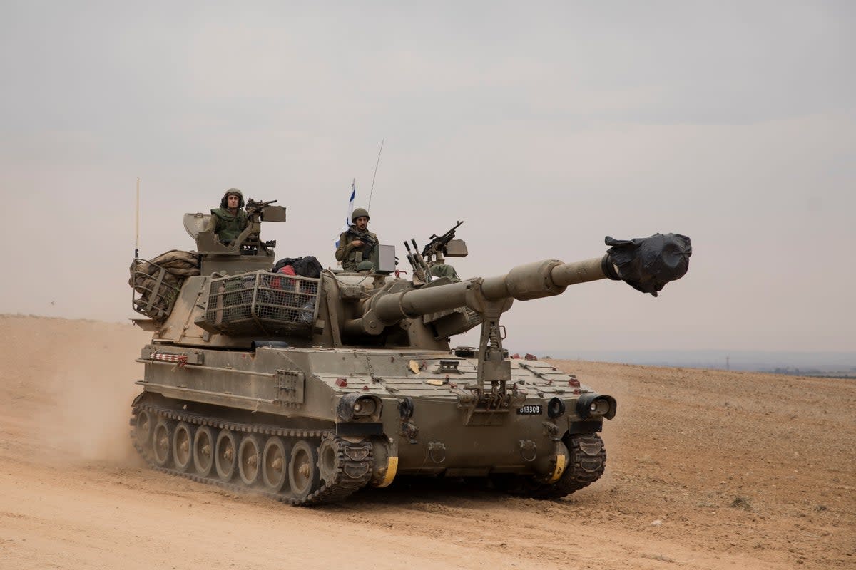 An Israeli tank drives toward the Israeli southern border with the Gaza Strip (Getty Images)