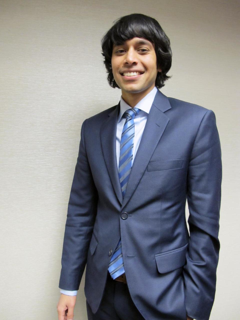 Shezanne Cassim poses for the picture in the office of his attorney, Friday, Jan. 17, 2014, in Minneapolis. The American who spent nine months in prison in the United Arab Emirates for posting a satirical video online says he felt fear at times and was kept in filthy conditions. Cassim was accused of violating the country’s cybercrimes law. He says he did nothing wrong by posting his parody video online. (AP Photo/Amy Forliti)