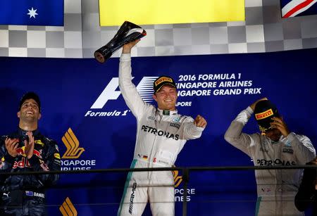 Formula One - F1 - Singapore Grand Prix - Marina Bay, Singapore - 18/9/16. Mercedes' Nico Rosberg of Germany celebrates after winning the race. REUTERS/Jeremy Lee