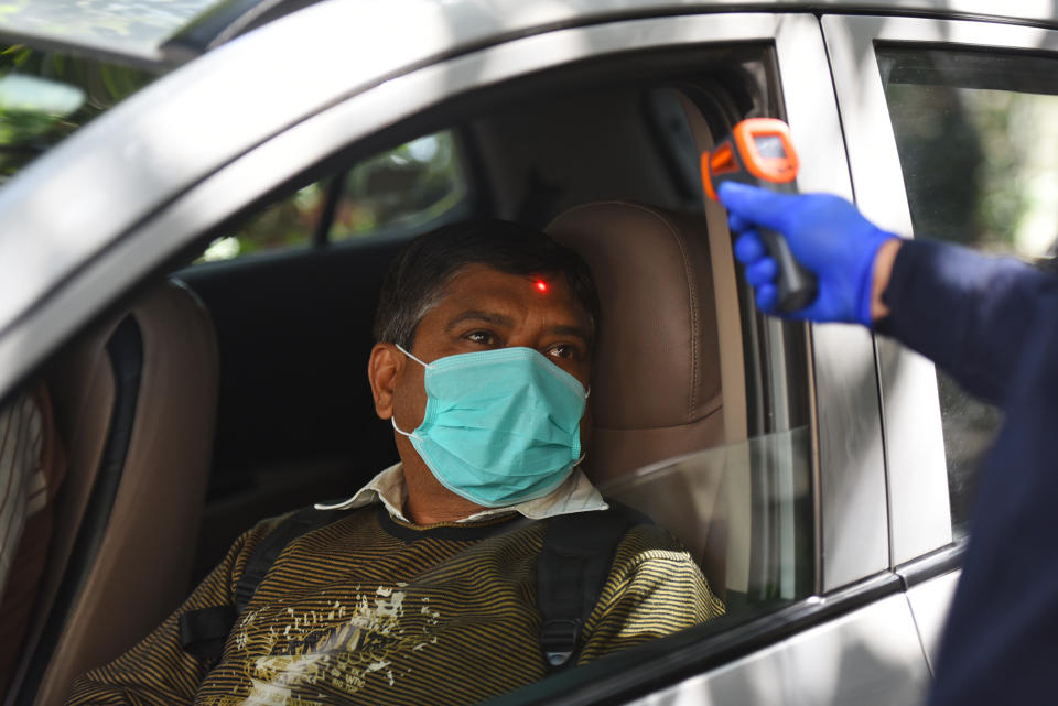 A car driver goes through thermal screening amid the coronavirus scare.