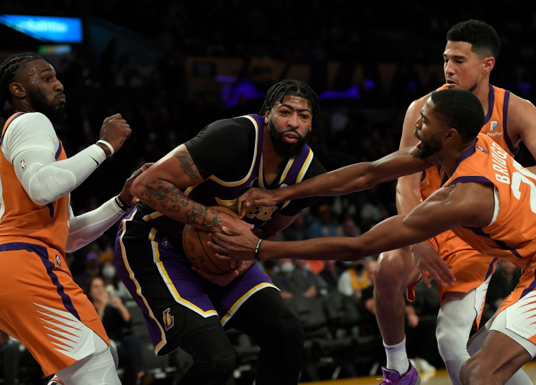 LOS ANGELES, CA - OCTOBER 22: Anthony Davis #3 of the Los Angeles Lakers is surrounded Mikal Bridges.