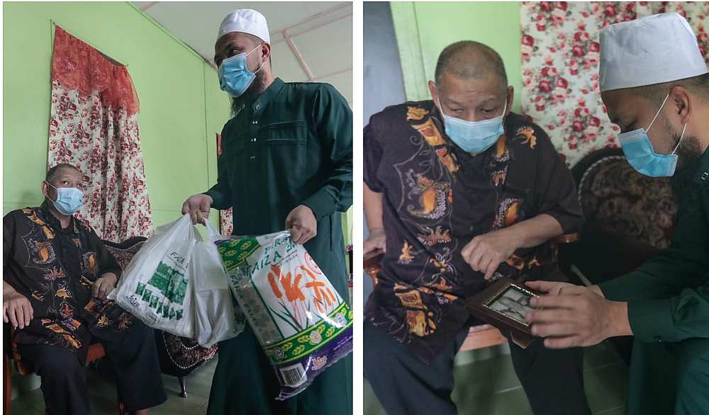 Ustaz Ebit Lew delivering groceries and looking through old photos of Sazali Ramlee. — Picture via Facebook/EbitLew