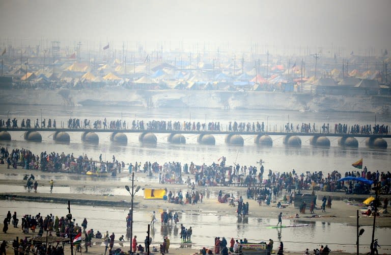 <p>Indian Hindu devotees gather on the bank of River Ganges to take a holy dip to mark “Mauni Amavasya” during the annual Magh Mela festival in Allahabad on February 8, 2016. </p>