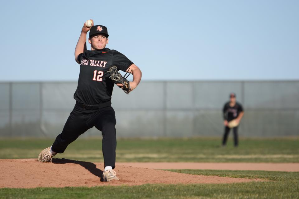 Apple Valley’s Beau Lloyd delivers a pitch during the third inning against Oak Hills on Friday, March 8, 2024. Oak Hills defeated Apple Valley 5-3 in the Mojave River League opener.