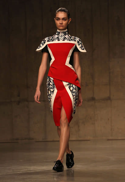 <b>LFW AW13: Peter Pilotto <br></b><br>Dresses featured high necks and a thigh-high split design.<br><br>© Getty