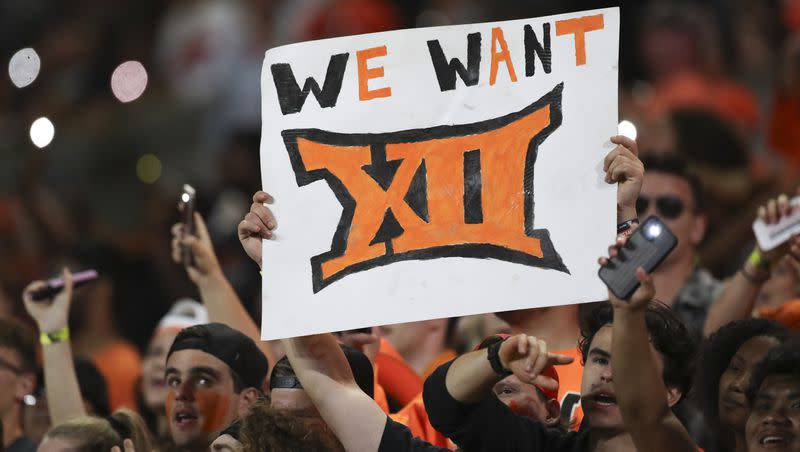 An Oregon State fan holds up a sign reading ‘We Want XII’ during a game against UC Davis Saturday, Sept. 9, 2023, in Corvallis, Ore. The Beavers will host the Utes Friday night in a prime-time affair.