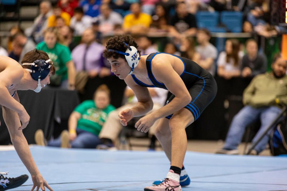 Washburn Rural's Landen Kocher-Muñoz wrestles against Mill Valley's Dillon Cooper for the 138 weight class title in 6A State Wrestling on Saturday, Feb. 24, 2024.