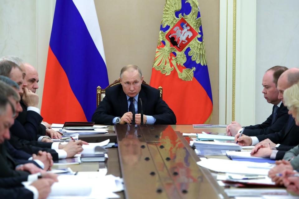 Russian President Vladimir Putin, center, leads a cabinet meeting in the Kremlin in Moscow, Russia, Tuesday, March 17, 2020. (Mikhail Klimentyev, Sputnik, Kremlin Pool Photo via AP)