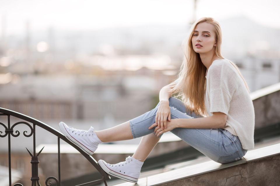 how to clean white shoes, close up of a person wearing white shoes