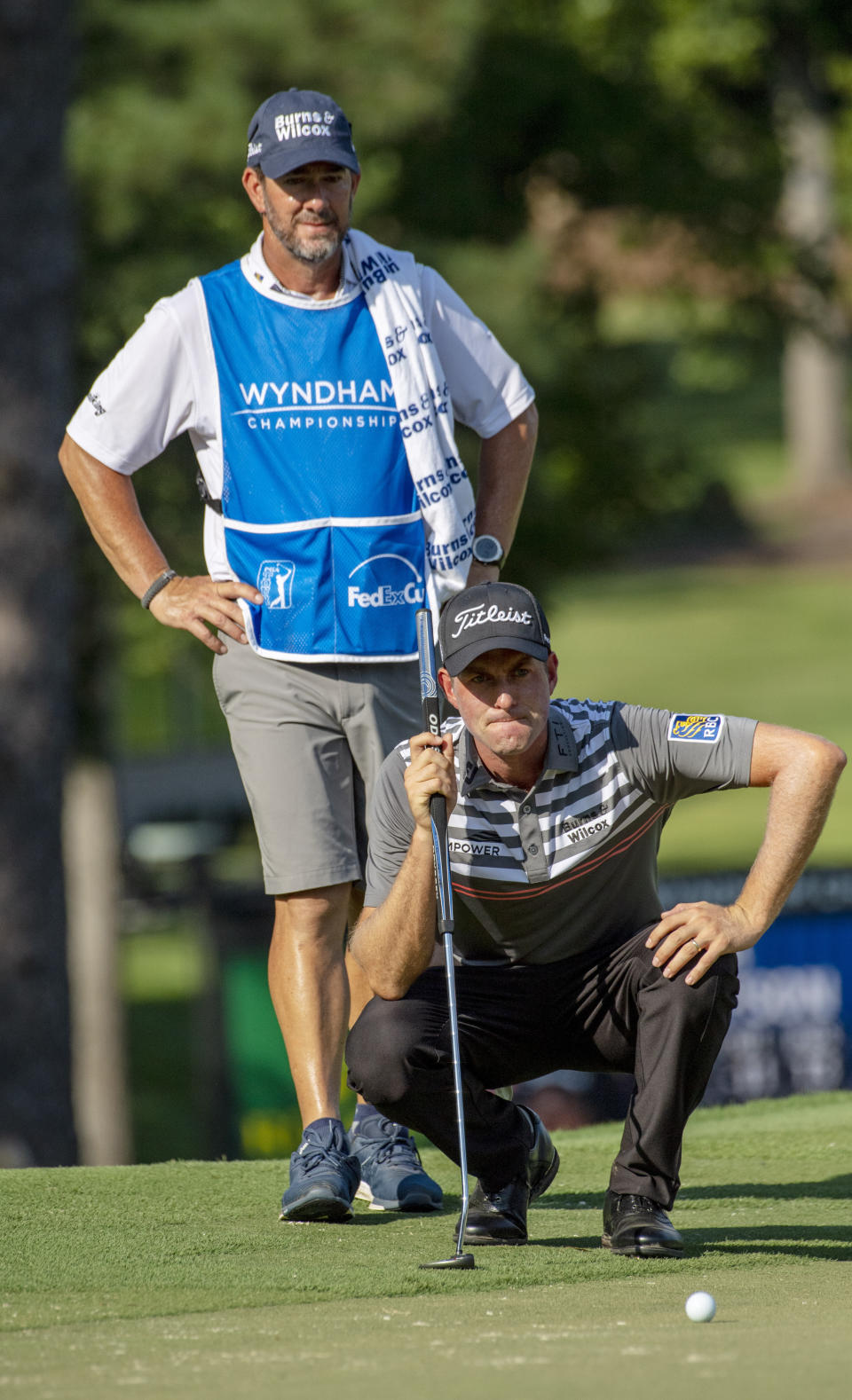 Webb Simpson lines up his birdie putt on the 18th green at the Wyndham Championship at Sedgefield Country Club in Greensboro, N.C., on Friday, Aug. 2, 2019. (Woody Marshall/News & Record via AP)