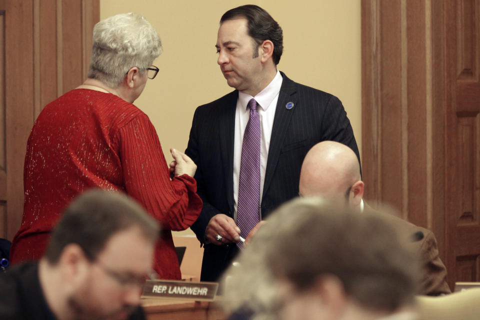 Kansas state Rep. Brenda Landwehr, left, R-Wichita, confers with Chair Troy Waymaster, right, R-Bunker Hill, during a meeting of the House Appropriations Committee, Wednesday, Feb. 28, 2024, at the Statehouse in Topeka, Kan. The committee has approved increased funding for home and community-based services for physically and intellectually disabled Kansans. (AP Photo/John Hanna)