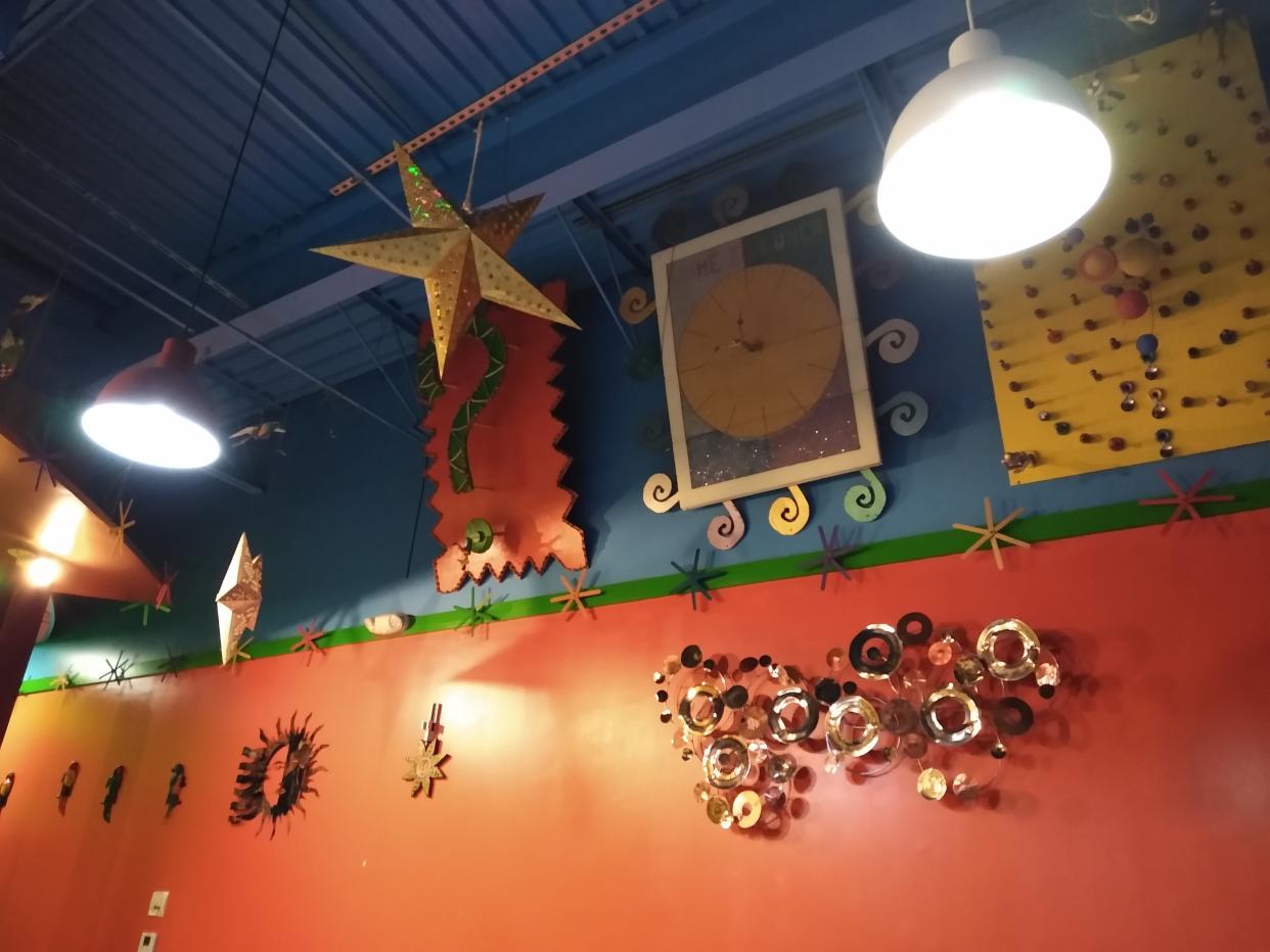 Eye-catching artwork hangs on the walls at Mucho Bueno’s in Brunswick.