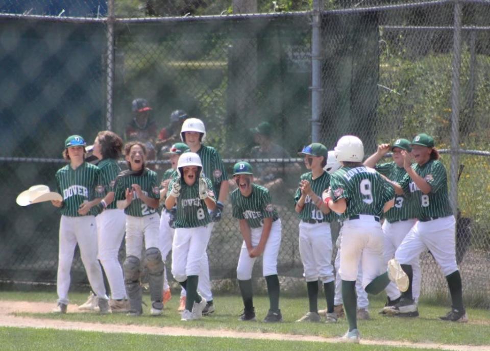 Members of the Dover Cal Ripken 12-year-old all-star team celebrate Tuesday's 2-1 win over Hudson.