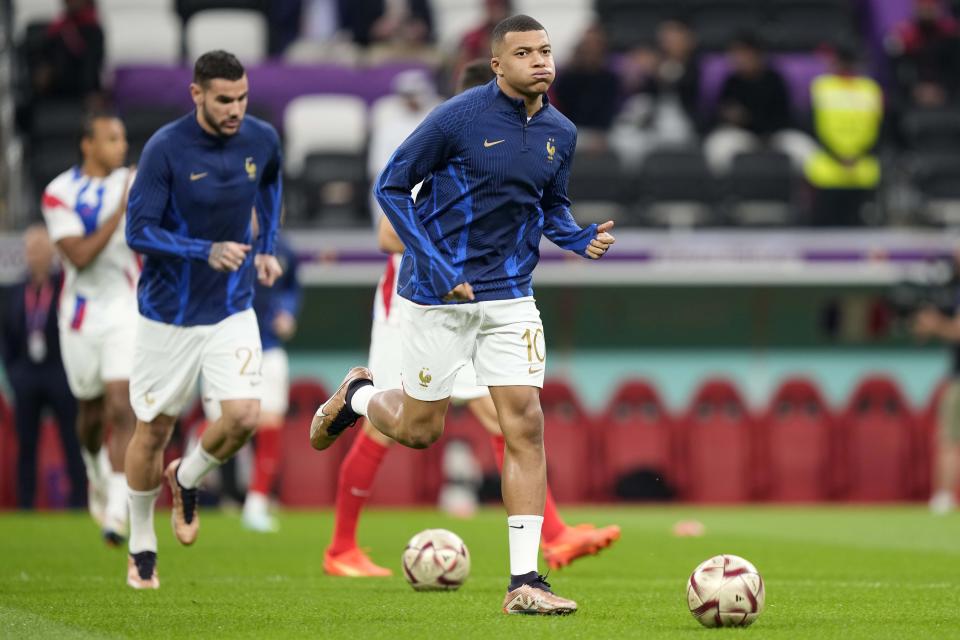 France's Kylian Mbappe warms up for the World Cup semifinal soccer match between France and Morocco at the Al Bayt Stadium in Al Khor, Qatar, Wednesday, Dec. 14, 2022. (AP Photo/Martin Meissner)