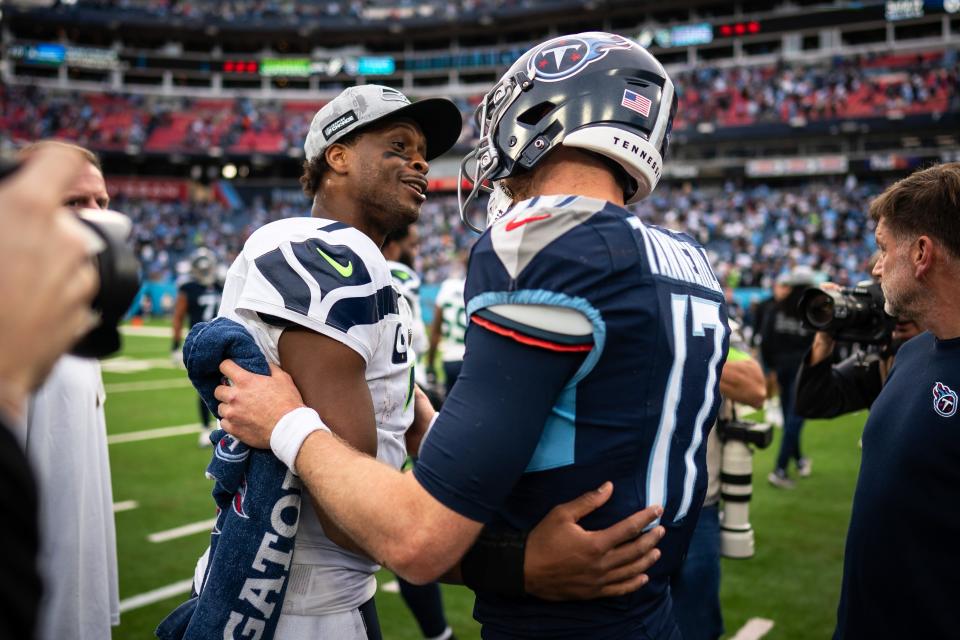 Seattle Seahawks quarterback Geno Smith greets Tennessee Titans quarterback Ryan Tannehill after the Seahawks won.