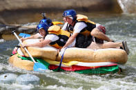 Competitors tackle Grade 3 rapids on a giant sandwich during the Red Bull Rapids at Penrith Whitewater Stadium, in Sydney, Australia.