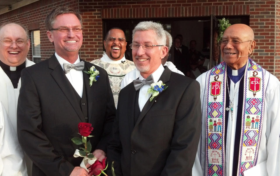 From left, the Rev. Kevin Higgs, Bobby Prince, the Rev. J.R. Finney, Joe Openshaw and retired Bishop Melvin Talbert stand together after Talbert officiated Prince and Openshaw's wedding in Birmingham, Ala. on Saturday, Oct. 26, 2014. The Council of Bishops has called for a formal complaint against Talbert, who presided at the wedding over the objections of a local bishop. (AP Photo/The Birmingham News, Greg Garrison)