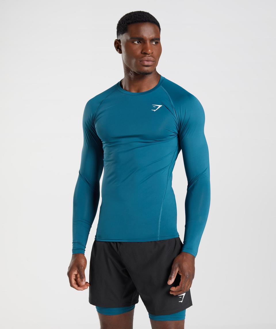 <p><a href="https://go.redirectingat.com?id=74968X1596630&url=https%3A%2F%2Fus.shop.gymshark.com%2Fproducts%2Fgymshark-element-baselayer-long-sleeve-top-atlantic-blue-aw22%3Fgclsrc%3Daw.ds%26gclsrc%3Daw.ds%26gclid%3DEAIaIQobChMIz76t29WtgQMVsh59Ch3mGQsoEAQYBCABEgIHZvD_BwE&sref=https%3A%2F%2Fwww.menshealth.com%2Ffitness%2Fg26966650%2Fbest-compression-shirts%2F" rel="nofollow noopener" target="_blank" data-ylk="slk:Shop Now;elm:context_link;itc:0;sec:content-canvas" class="link ">Shop Now</a></p><p>Element Baselayer Long Sleeve Top</p><p>gymshark.com</p><p>$15.60</p>