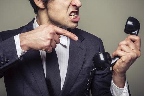 Man yelling at telephone