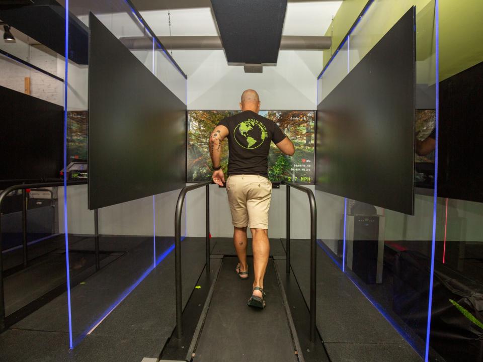 Someone running on the treadmill pod at Roam149.