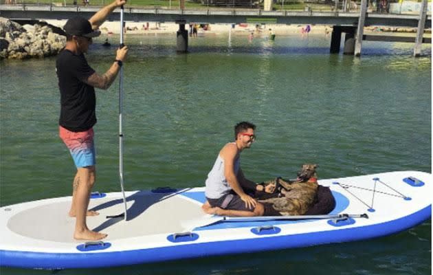 Despite his injured leg he went paddle boarding. Photo: Supplied