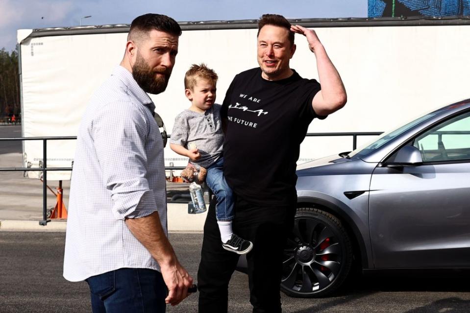 Musk carries his son X AE A-XII on Wednesday. FILIP SINGER/EPA-EFE/Shutterstock