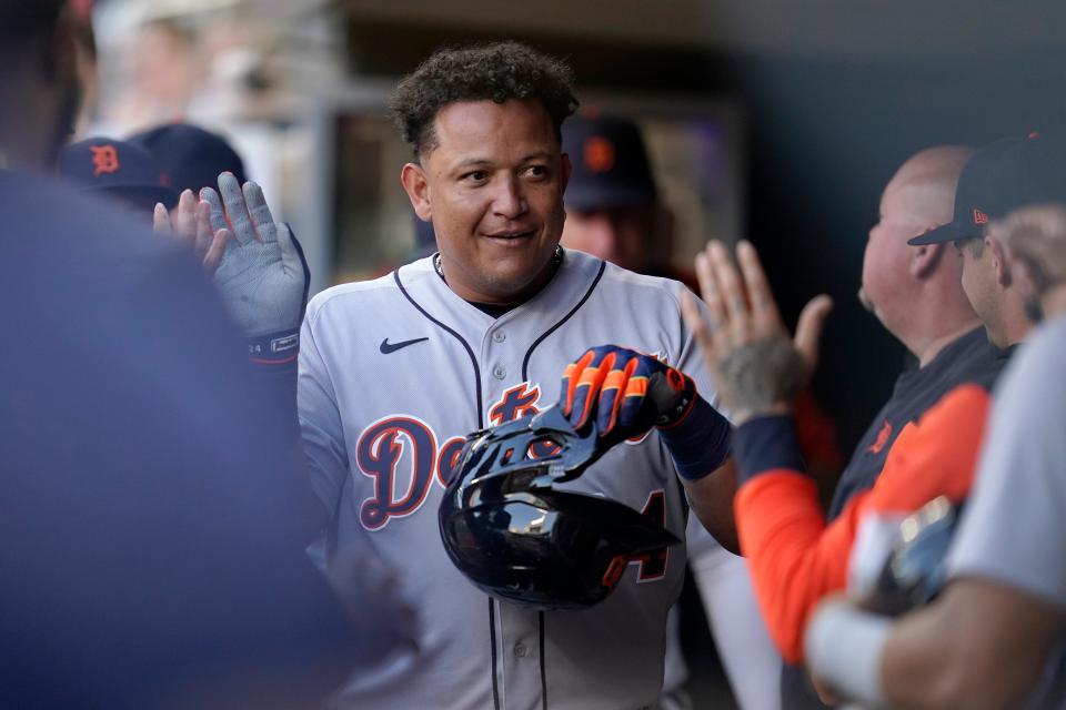 Tigers designated hitter Miguel Cabrera celebrates in the dugout after scoring off an RBI-single by Tucker Barnhart against the Minnesota Twins during the top of the fourth inning on Monday, Aug. 1, 2022, in Minneapolis.