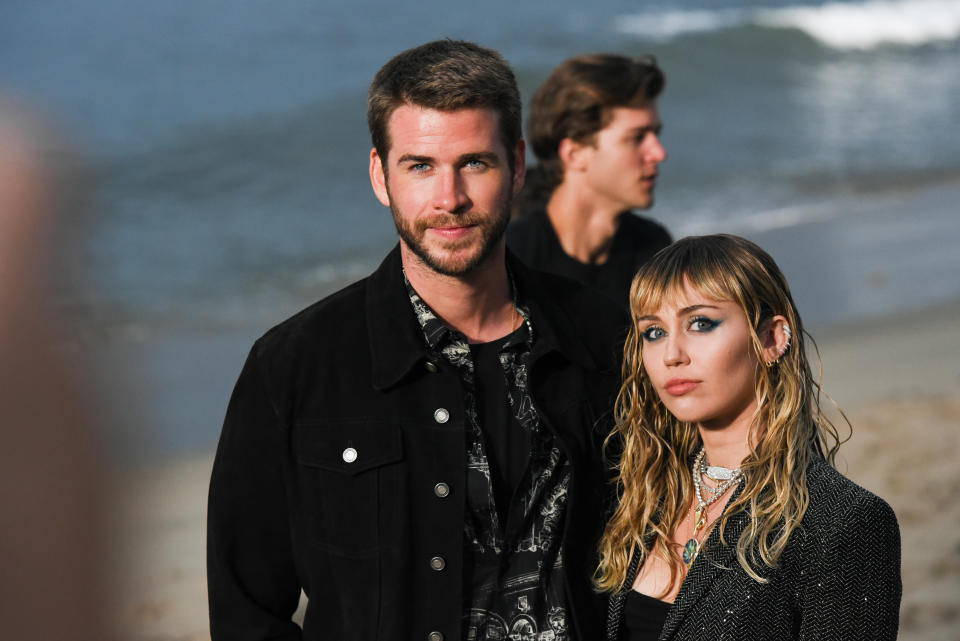 MALIBU, CALIFORNIA - JUNE 06: Liam Hemsworth and Miley Cyrus at Saint Laurent mens spring summer 20 show on June 06, 2019 in Malibu, California. (Photo by Presley Ann/WireImage,)