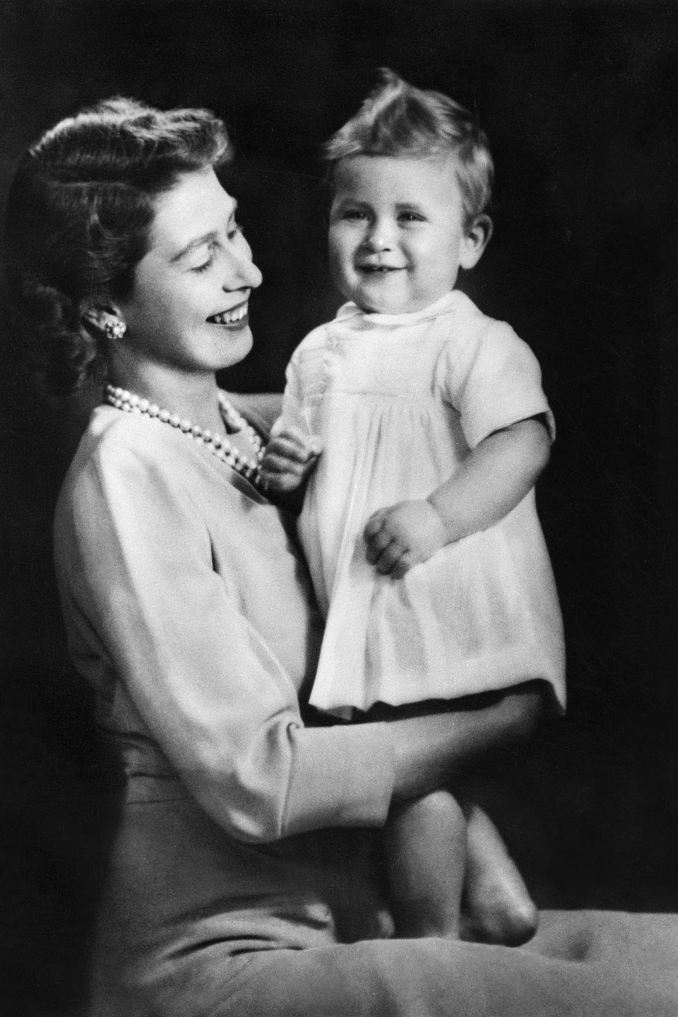 <p>Posing with his mother, Queen Elizabeth II, for a portrait. </p>