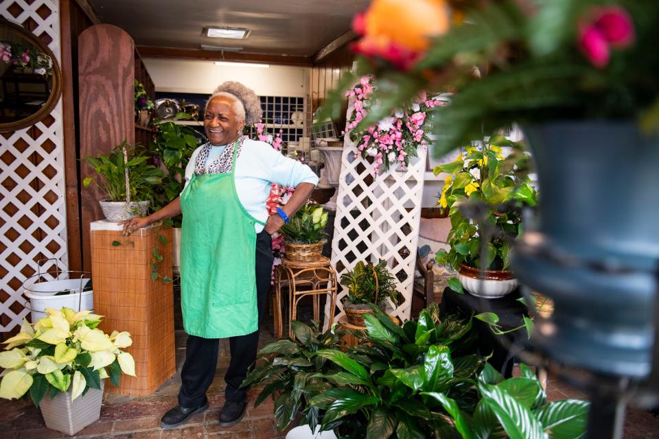 Pat Agnew, owner of Flowers by Pat, smiles inside her shop on Friday, Jan. 13, 2023. 