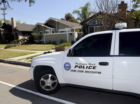 Huntington Beach police Crime Scene Investigator vehicle is seen at the family home of Denise Huskins in Huntington Beach, California March 25, 2015. REUTERS/Bob Riha Jr