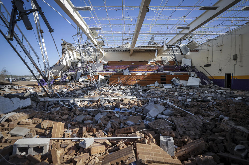 The gym of Crestview Elementary School, where students usually gather to ride out storms, was damaged by a tornado the day before in Covington, Tenn., on Saturday, April 1, 2023. Storms that spawned possibly dozens of tornadoes have killed several people in the South and Midwest. (Patrick Lantrip/Daily Memphian via AP)