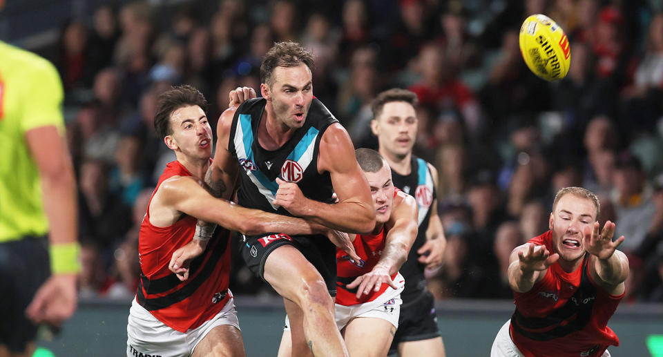 Seen here, Jeremy Finlayson in action for Port Adelaide against Essendon in the AFL.