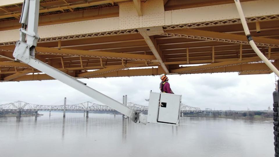 Kentucky Transportation Cabinet engineers inspect the George Rogers Clark Memorial Bridge over the Ohio River on March 2 following a multi-vehicle crash the day before that sent a semitruck over the side of the bridge, leading to a rescue that captured national attention.