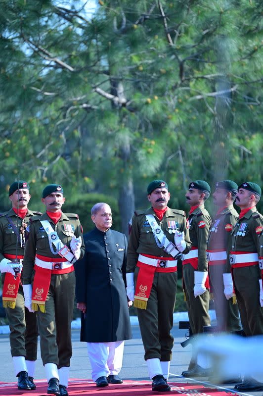 Pakistan's newly elected Prime Minister Shehbaz Sharif, inspects the honor guard at the Prime Minister's House in Islamabad