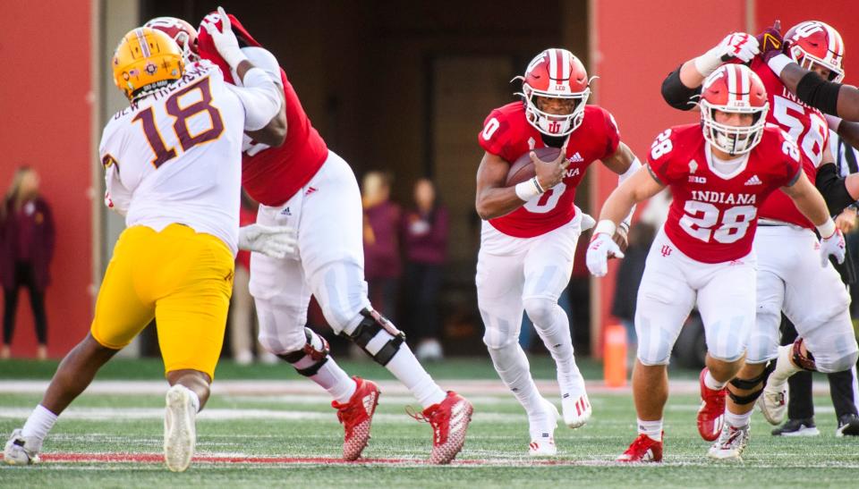 Indiana's Donaven McCulley (0) runs during the first half of the Indiana versus Minnesota football game at Memorial Stadium on Saturday, Nov. 20, 2021.