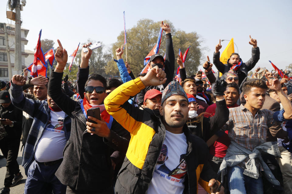 Nepalese pro-king supporters march demanding reinstating monarchy that was abolished more than a decade ago in Kathmandu, Nepal, Monday, Jan.11, 2021. Monday's protest was the latest anti-government protest against Prime Minister Khadga Prasad Oli who has been facing street demonstrations against him from a splinter faction of his own Communist party and more from opposition political groups for dissolving parliament. Nepal's centuries-old monarchy was abolished in 2008 by the parliament and replaced by a republic where the president was elected as the head of state. (AP Photo/Niranjan Shrestha)