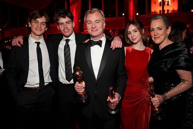 <p>Kevin Mazur/VF24/WireImage for Vanity Fair</p> Christopher Nolan and Emma Thomas pose with three of their children at the 2024 Oscars