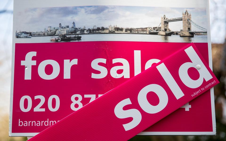 An estate agent's sign advertising a property as sold