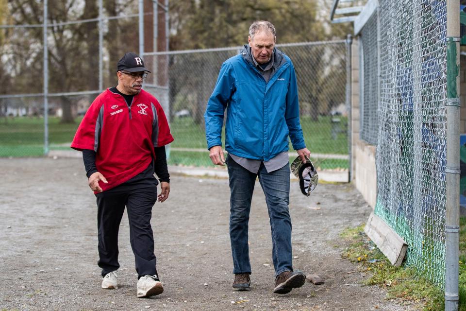 Chris Gregory, left, talks to Ken Schneider during practice at Stoepel Park in Detroit on Tuesday, April 25, 2023.