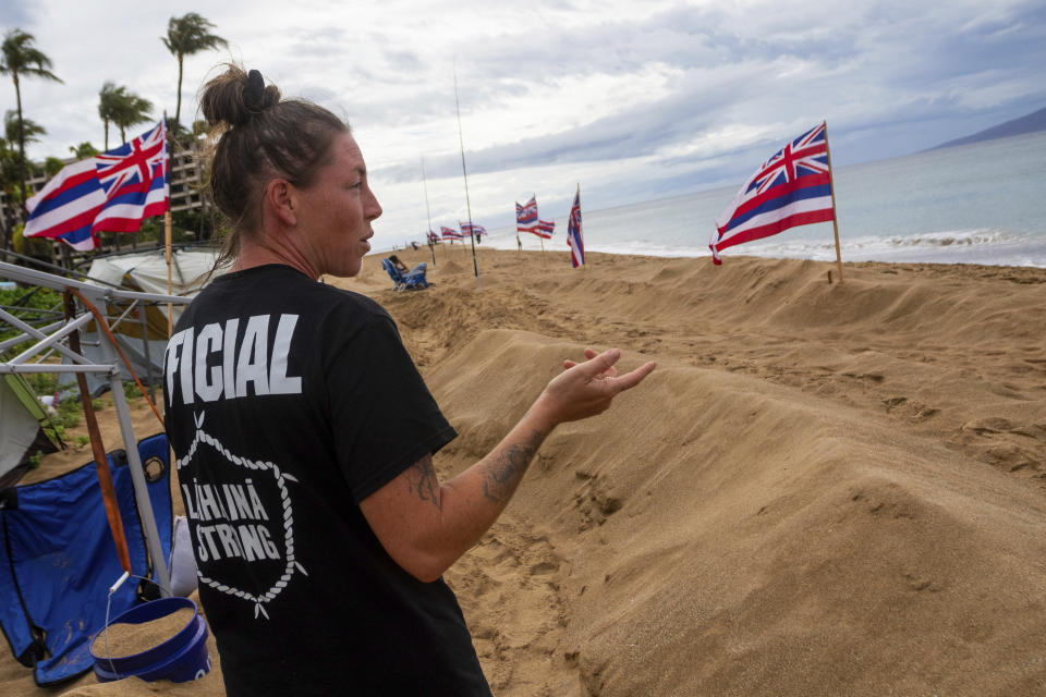 Katie Austin walking around the "Fish-in" on, Friday, Dec. 1, 2023, in Lahaina, Hawaii. Lahaina Strong has set up a "Fish-in" to protest living accommodations for those displaced by the Aug. 8, 2023 wildfire, the deadliest U.S. wildfire in more than a century. More than four months after the fire, tensions are growing between those who want to welcome tourists back to provide jobs and those who feel the town isn't ready for a return to tourism." (AP Photo/Ty O'Neil)