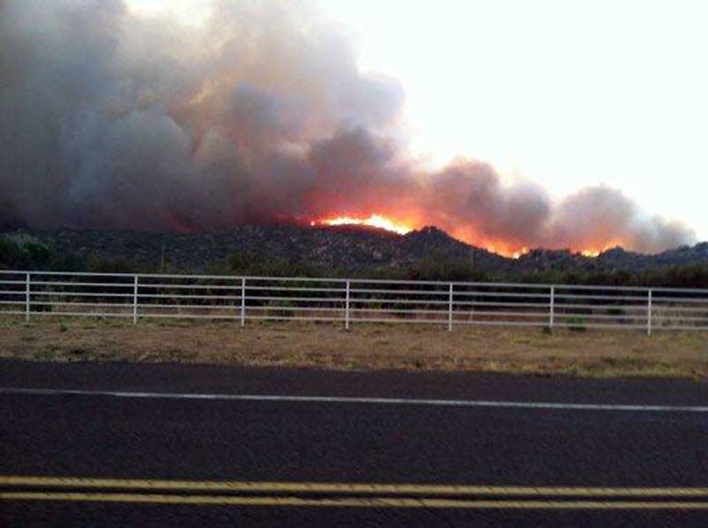 The Yarnell Hill fire burns in this view from Highway I-17 June 29, 2013 near the town of Yarnell, Arizona, about 80 miles (128 km) northwest of Phoenix. 